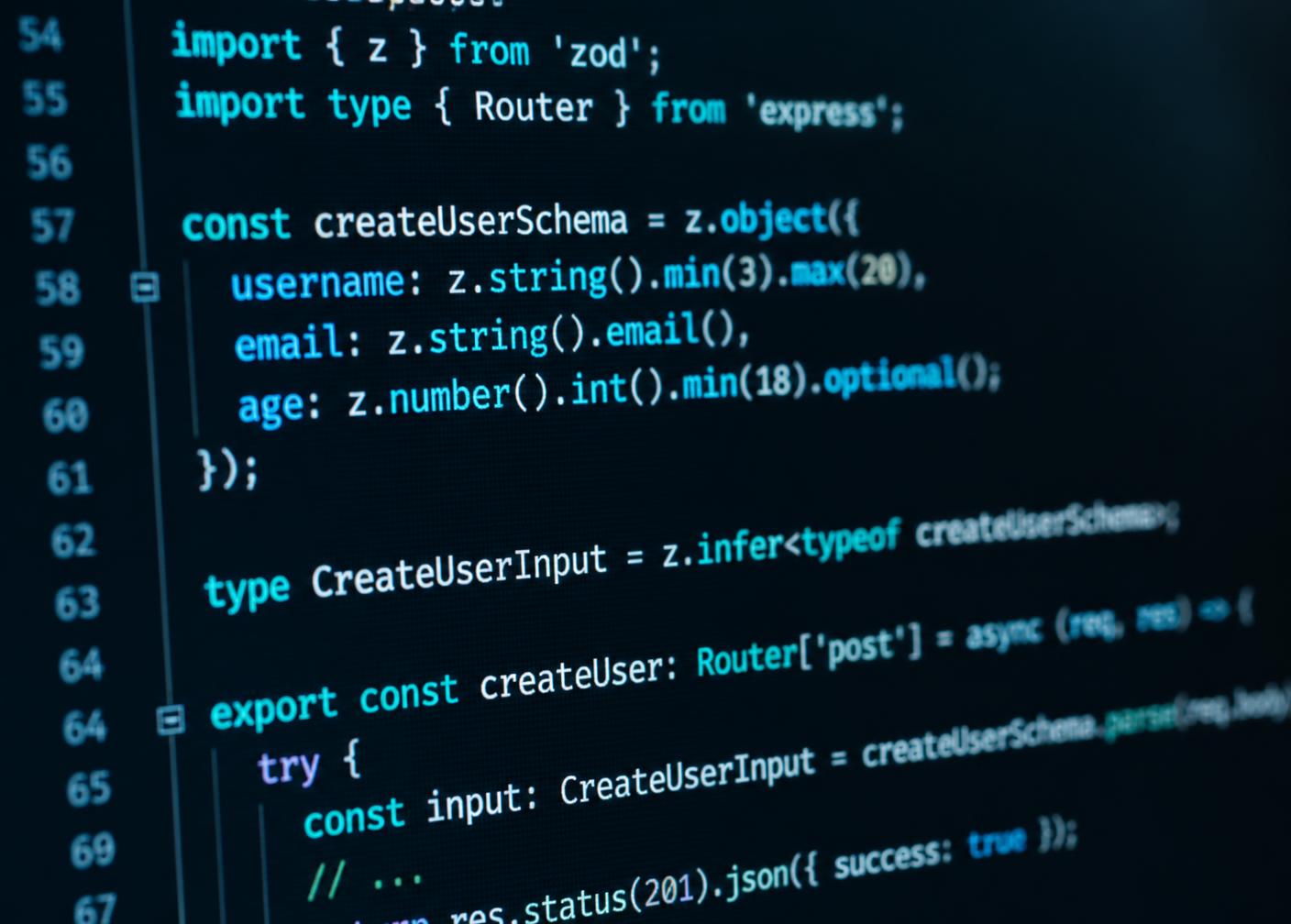 Close-up of React application code beside mobile app wireframes